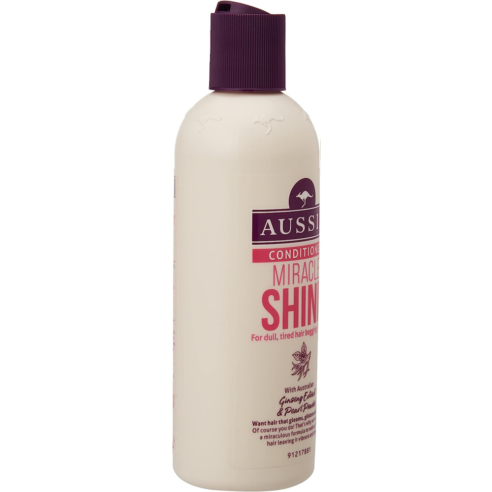 Aussie Conditioner Miracle Shine for Dull Tired Hair, 250ml 6 Pack - White bottle with purple label, featuring a rich, nourishing formula that adds a super boost of shine and gloss to every strand. Contains Australian Ginseng extract and Pearl powder extract for vibrant, shiny hair.