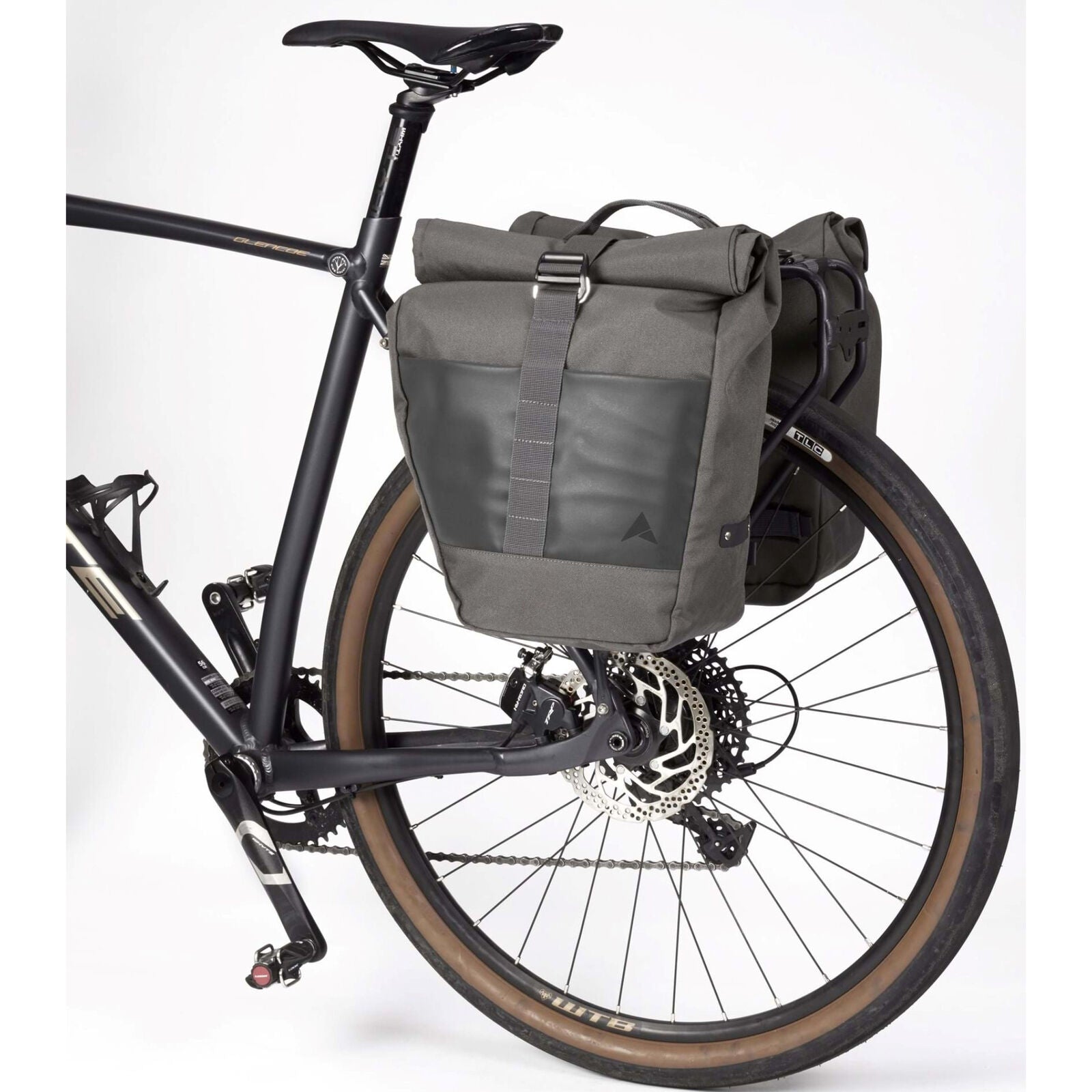 Versatile Altura Grid Cycling Pannier Roll Up Pair, each with 15L capacity. Ideal for commuting, touring, and bike packing. Roll up design for compact storage. Features roll-top closure, grab handle, reflective details, and DWR finish. Can be used individually or as a pair.