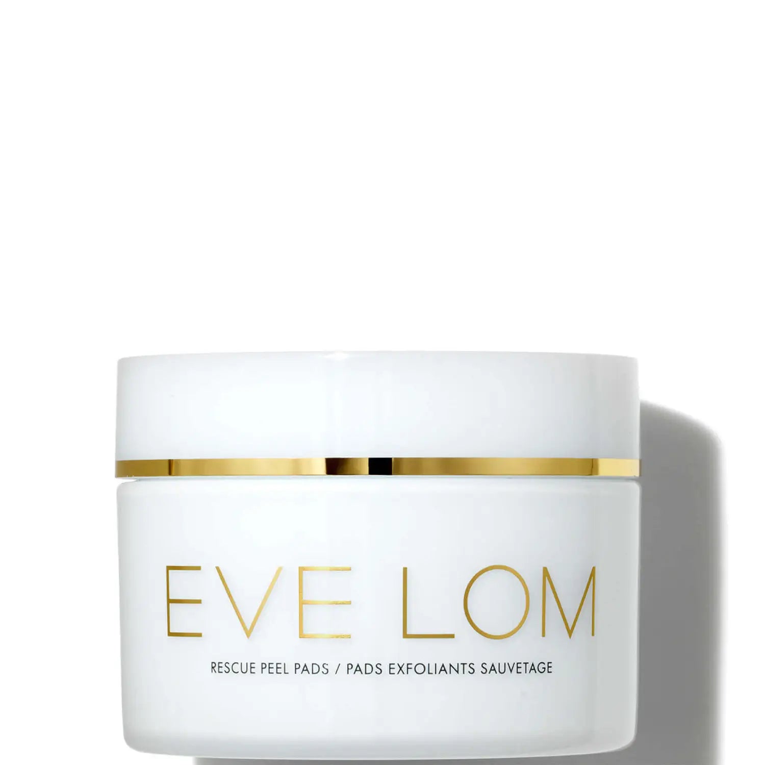 White container with gold text showcasing Eve Lom Rescue Peel Pads (60 Pads), an exfoliating and resurfacing treatment. The pads gently buff away dead skin, revealing a smoother, brighter, and revitalized complexion. Formulated with BHA, PHA, and AHA acids, including Glycolic Acid, the pads encourage fresher and healthier-looking skin. The Multi-Fruit Acid Complex, along with Lactic Acid, hydrates and conditions the skin, while Salicylic Acid, Marshmallow, and Vitamin B3 soothe and calm irritation. The pads