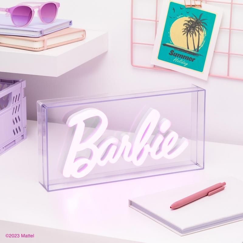 A vibrant Barbie LED Neon Light with the classic Barbie logo in LED neon, perfect for adding a pop of style and a bold, fun look to any space. Ideal for Barbie enthusiasts and collectors, this chic Paladone light combines retro style with modern flair.